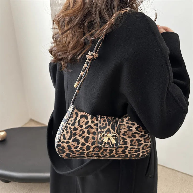 Women's casual PU leather handbag showing sandwich pocket design and available colour options