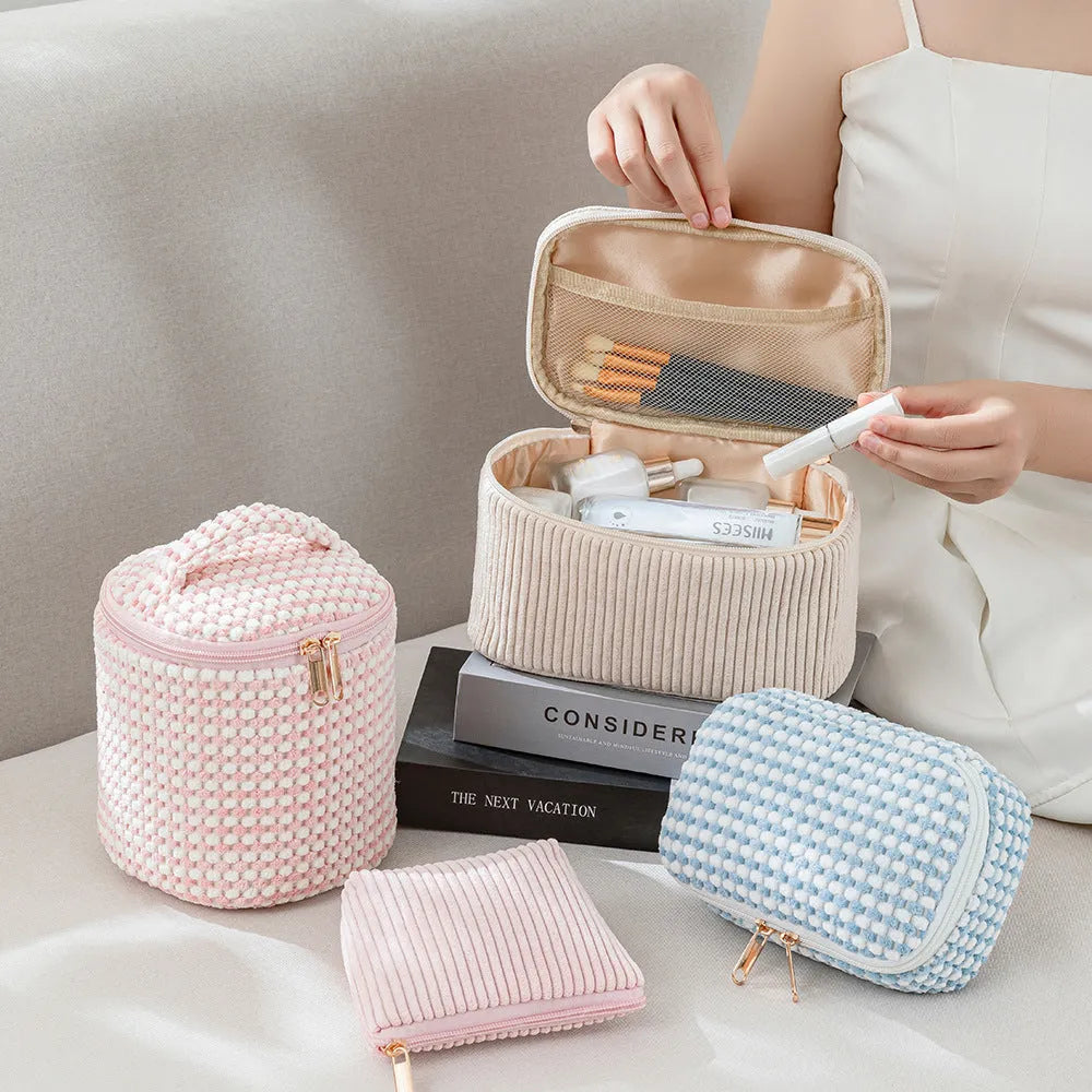 Four cube-style flannelette makeup bags in coordinating colours showing portable cosmetic organiser set