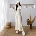 Women's mid-length A-line woolen skirt in a solid colour, shown on a model.
