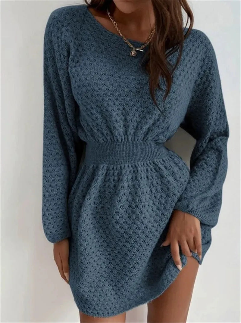 Blue women's knitted dress with French round neck, fitted waist, and hand-crocheted flower details