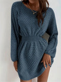 Blue women's knitted dress with French round neck, fitted waist, and hand-crocheted flower details