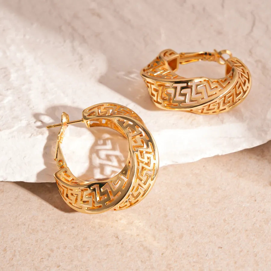 Geometric hollow stud earrings with twisted round design in gold or silver electroplated finish