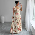 Apricot coloured floral print V-neck dress with ruffle sleeves and a flowing swing skirt.