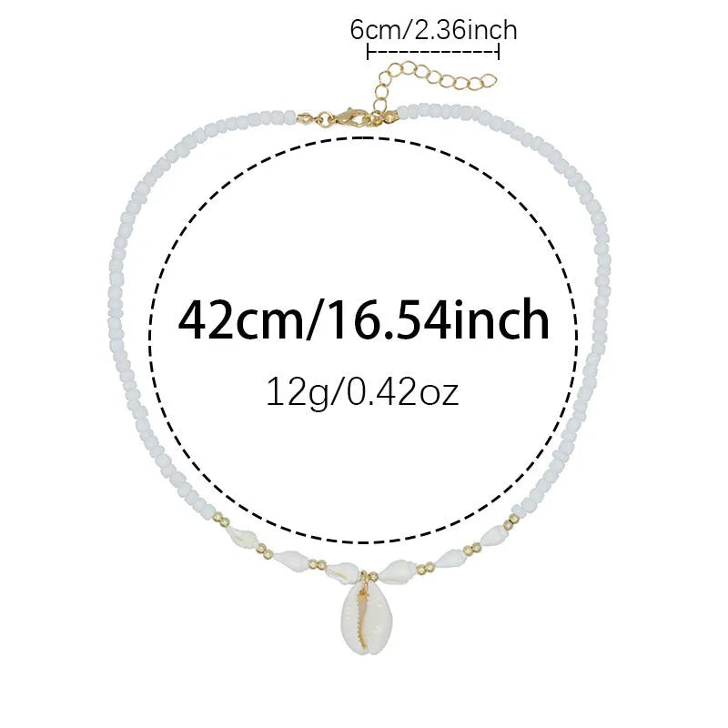 White conch shell necklace with mother pearl pendant on a regular electroplated chain.