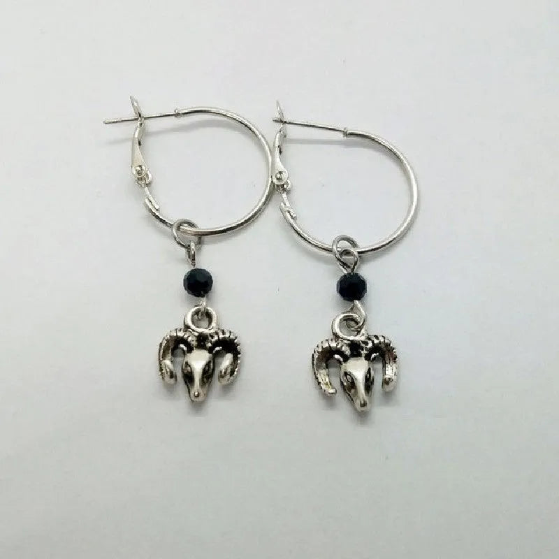 Silver-colour alloy earrings with a round ring Tibetan antelope design for women.