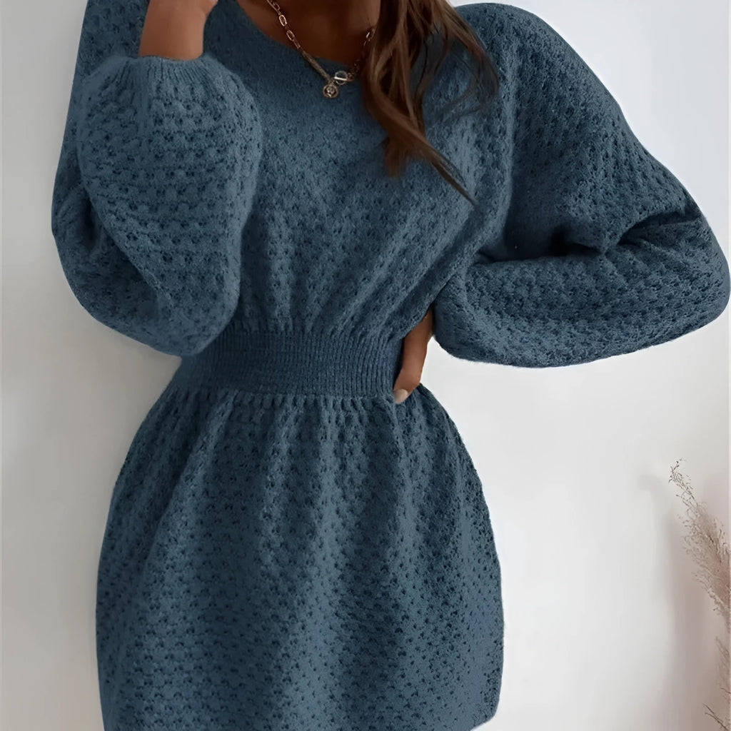 Blue women's knitted dress with French round neck, fitted waist, and hand-crocheted flower details