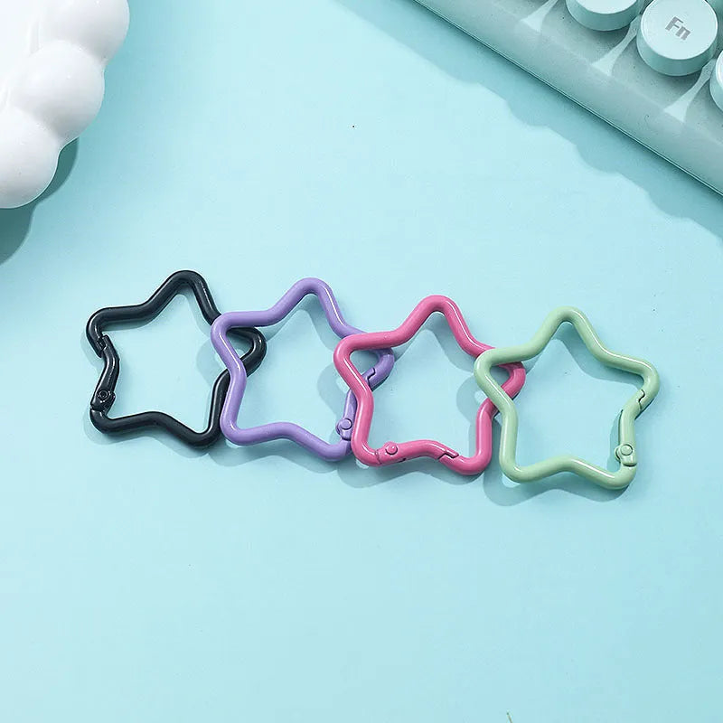 Zinc alloy five-pointed star keychain in light pink colour for backpack decoration