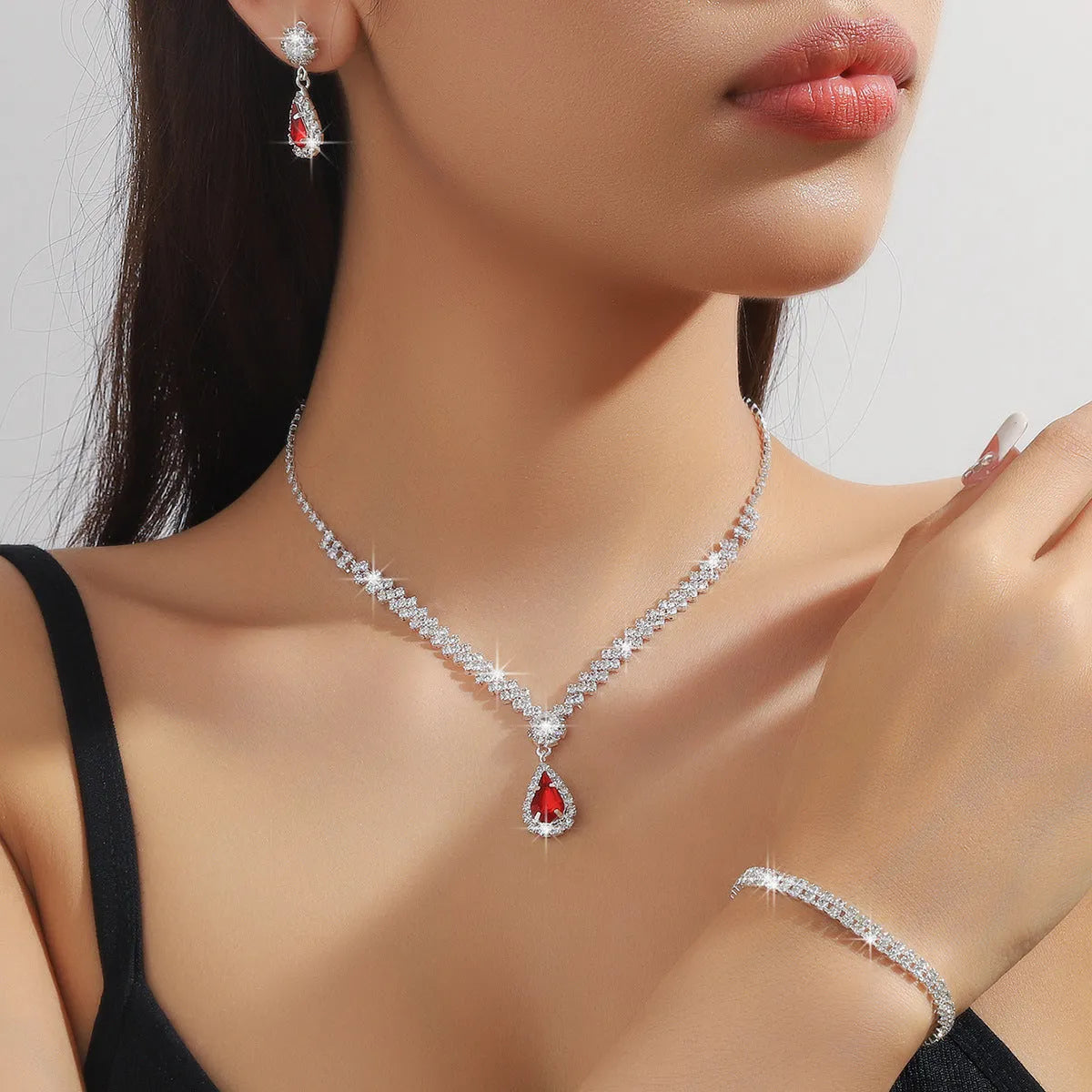 Claw chain necklace and earrings set with rhinestone water drops in multiple colour options