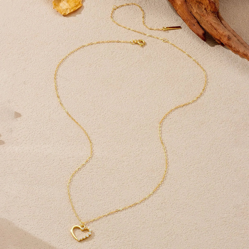 S925 sterling silver hollow heart and circle pendant necklace on a regular chain for women.