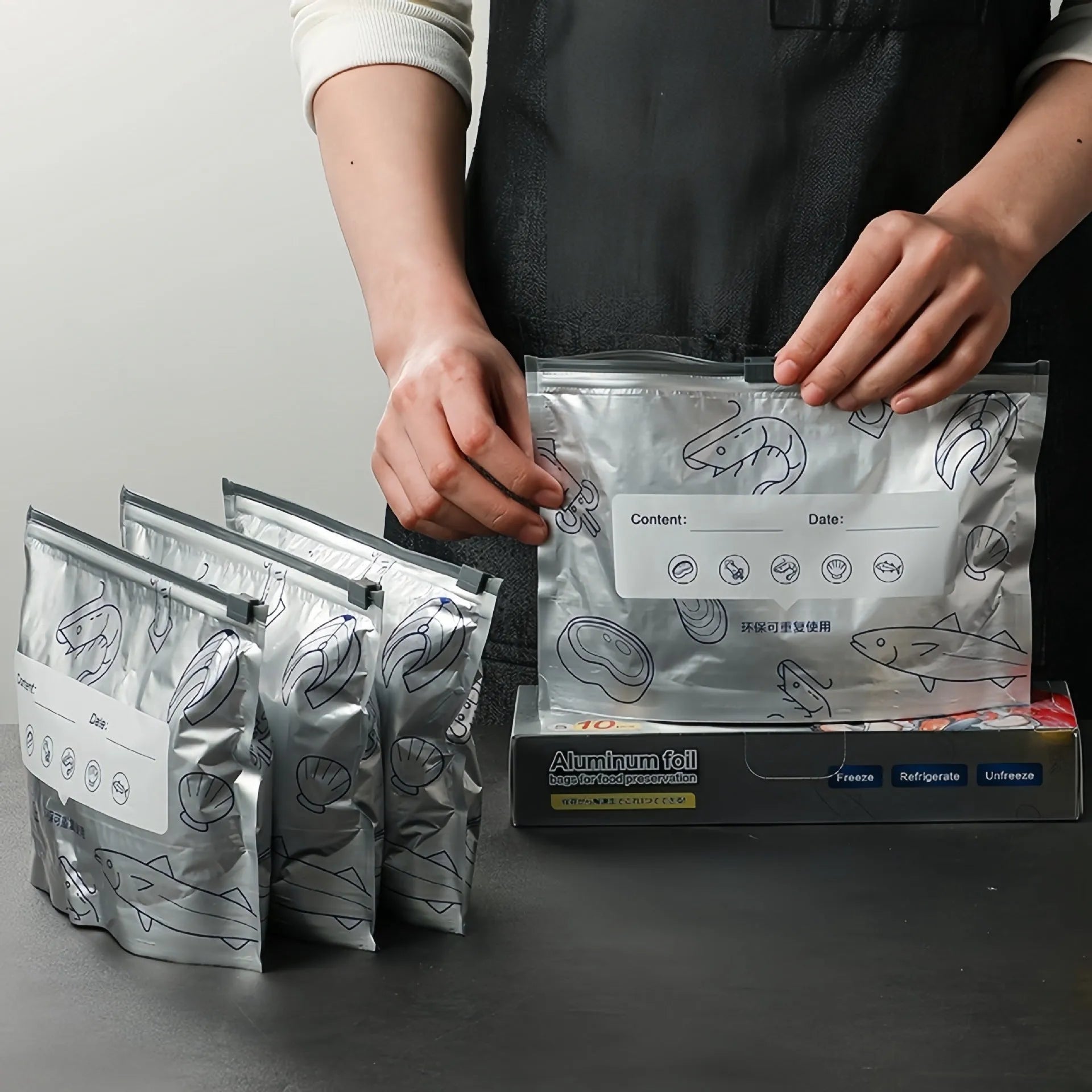Pack of ten aluminium foil fresh-keeping bags in three sizes: small, medium, and large.