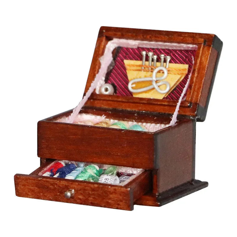 Small vintage sewing machine miniature ornament in a birch wood box with accessories.