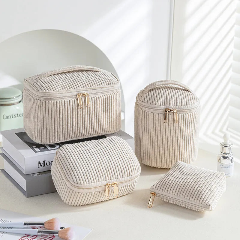 Four cube-style flannelette makeup bags in coordinating colours showing portable cosmetic organiser set