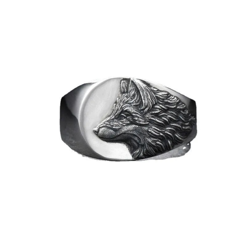 Men's silver geometric wolf head ring in retro domineering style on a grey background.
