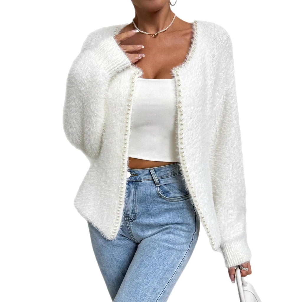 White women's V-neck cardigan with regular length polyester knit construction