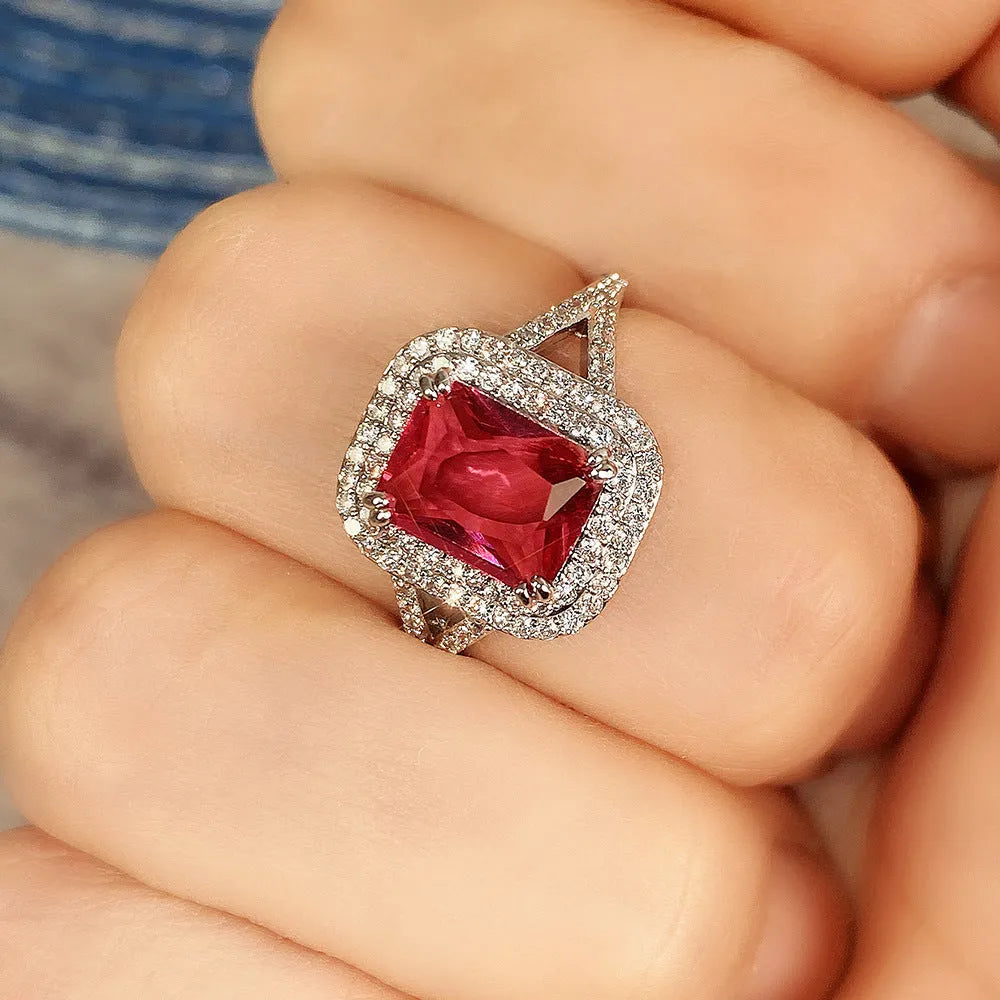 Red geometric square copper women's ring with a central princess stone setting.