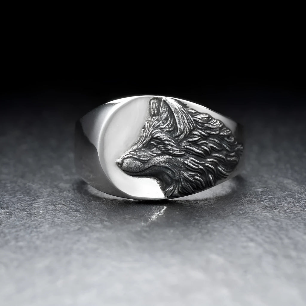 Men's silver geometric wolf head ring in retro domineering style on a grey background.
