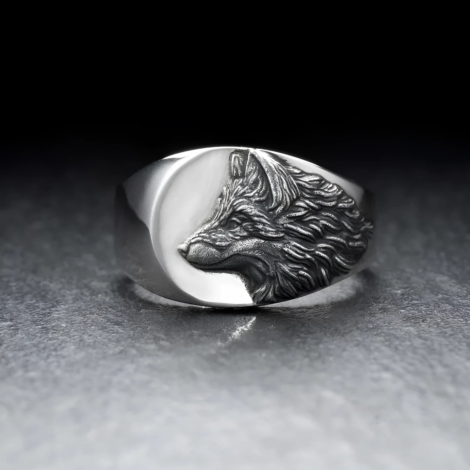 Men's silver geometric wolf head ring in retro domineering style on a grey background.