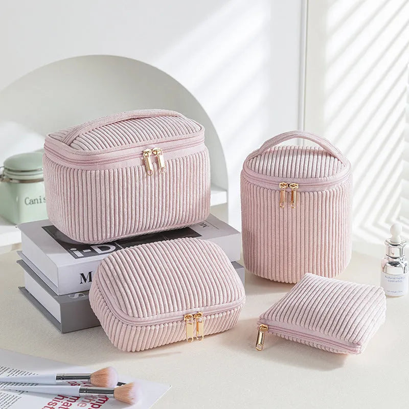 Four cube-style flannelette makeup bags in coordinating colours showing portable cosmetic organiser set