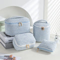 Four cube-style flannelette makeup bags in coordinating colours showing portable cosmetic organiser set