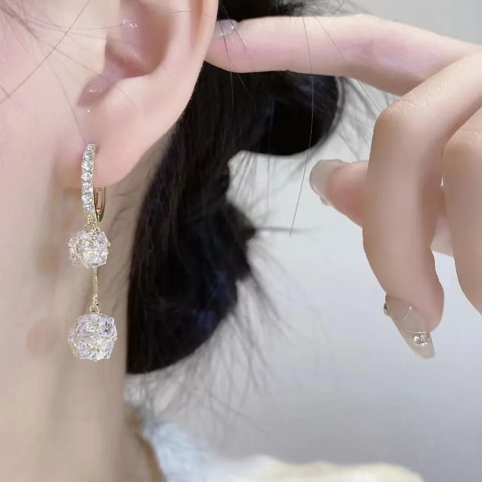 Women's silver tone drop earrings with tassel ball and rhinestone ball double pendant design