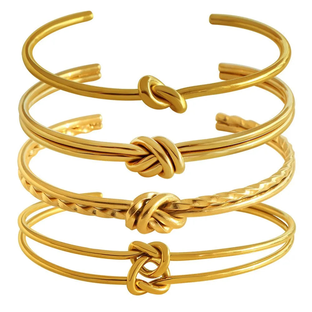Stainless steel women's bracelet with knotted C-shaped open design and double-layer construction in gold or silver