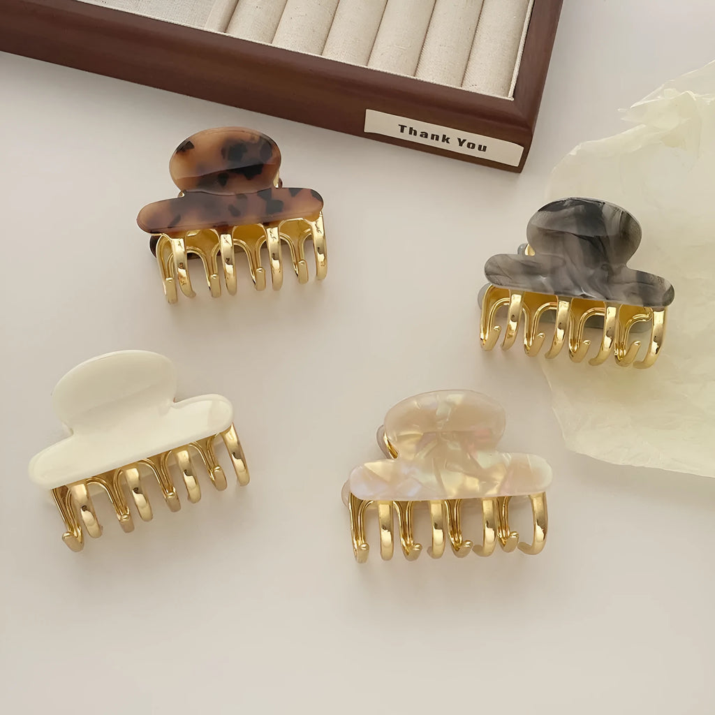 Women's retro acetate hair barrettes with metal grip in medium size showing four R08 colour options