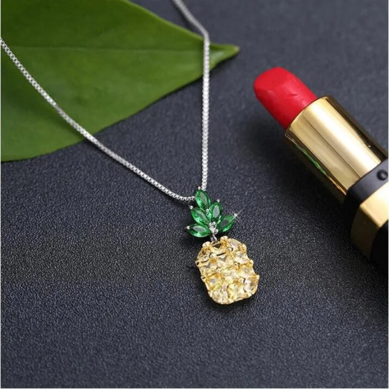 Silver geometric pineapple pendant necklace with diamond motif on chain