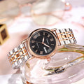 Women's automatic mechanical watch with 12mm thick case on a stainless steel bracelet with a white dial.