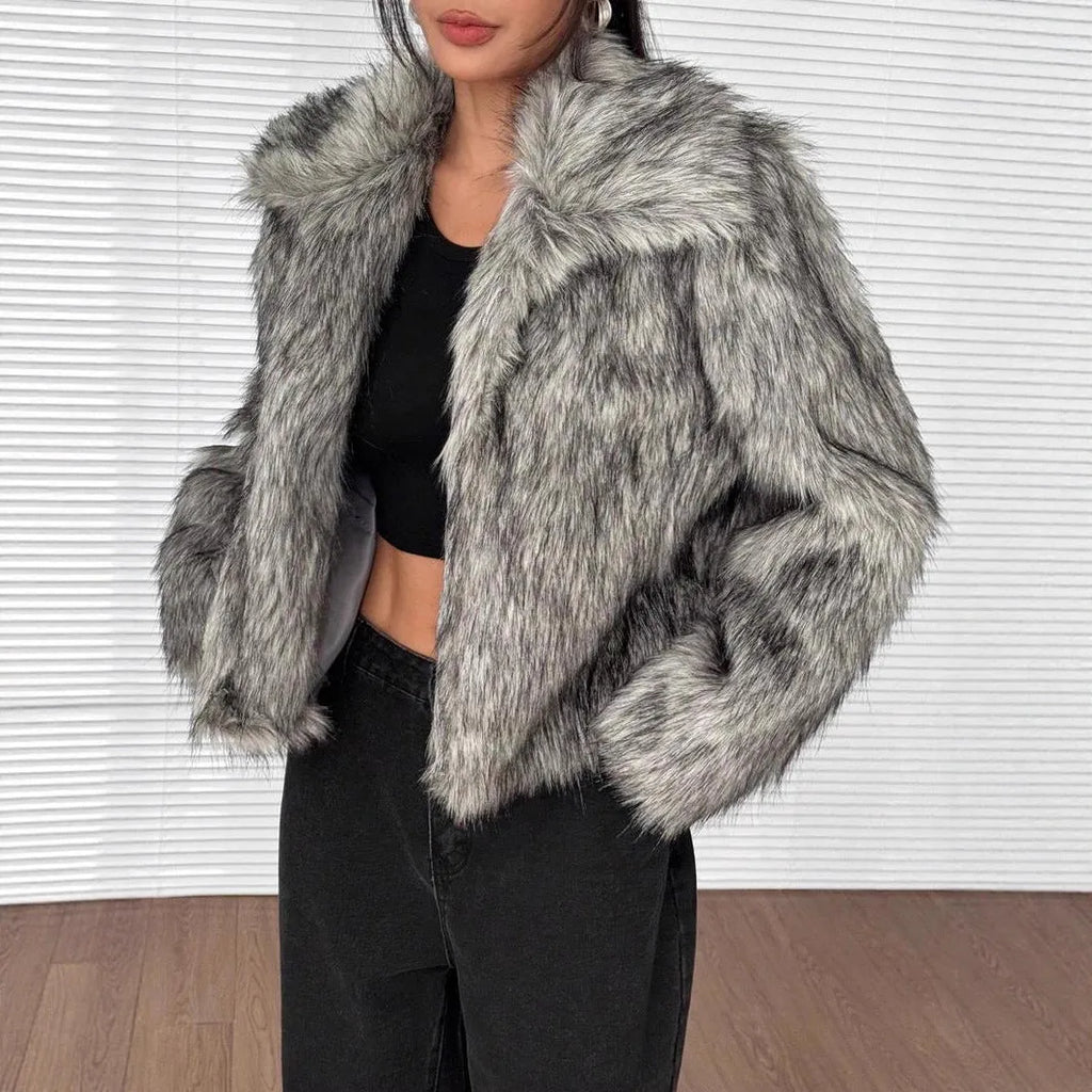 Women's short length artificial fur coat with a fur collar in a black tip on black background colour.