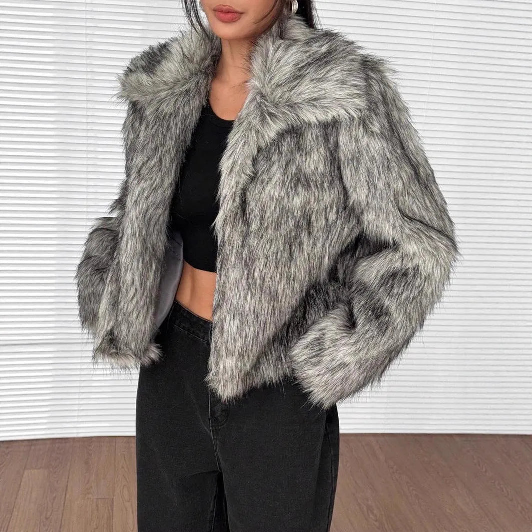 Women's short length artificial fur coat with a fur collar in a black tip on black background colour.