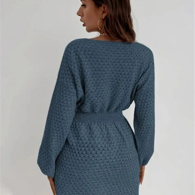 Blue women's knitted dress with French round neck, fitted waist, and hand-crocheted flower details