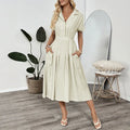 Light green twill lapel shirt dress with waist tie and splicing detail on a mannequin