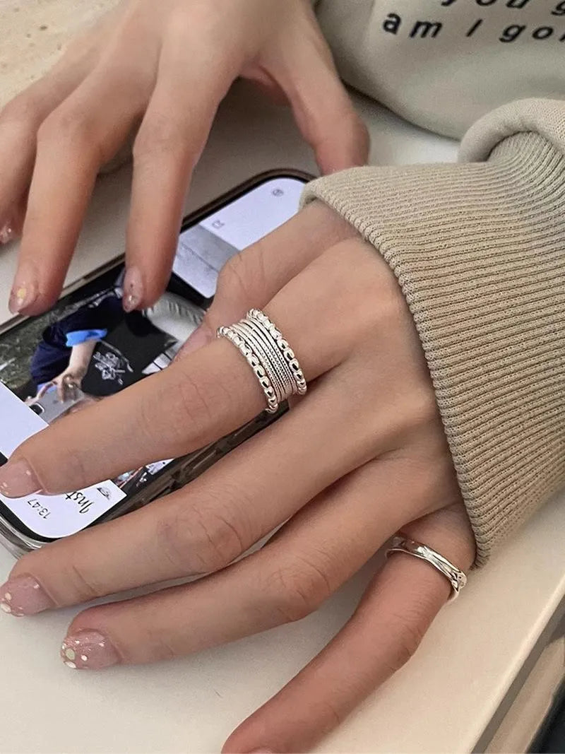 Women's adjustable geometric copper ring with woven twisted multilayer design