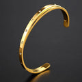 Open-ended women's bracelet with zircon stones and love heart element in rose gold finish