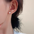 A pair of simple fishtail design earrings in a choice of white gold or yellow gold colour.
