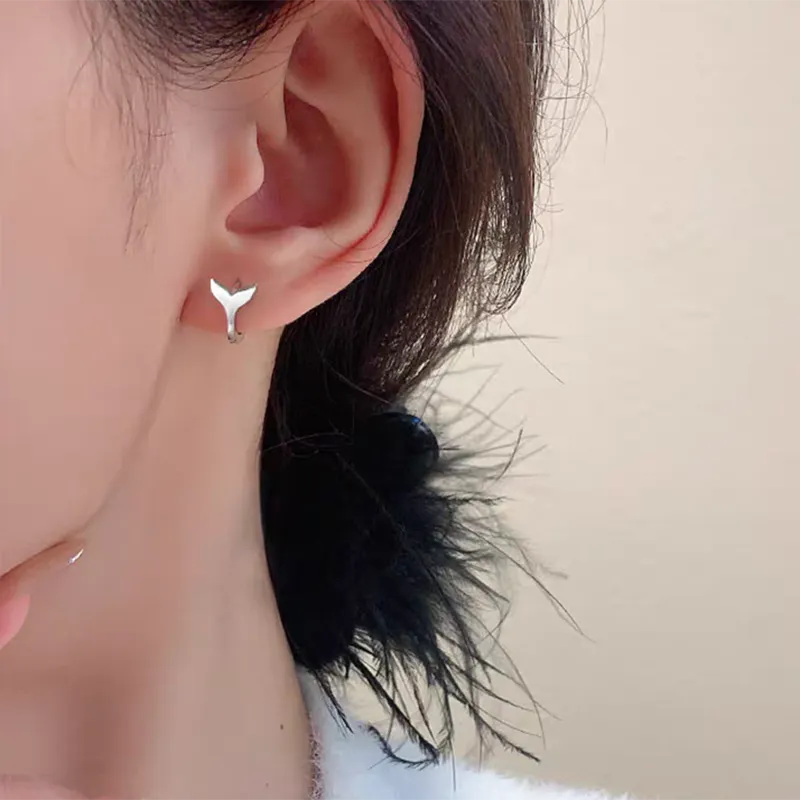 A pair of simple fishtail design earrings in a choice of white gold or yellow gold colour.