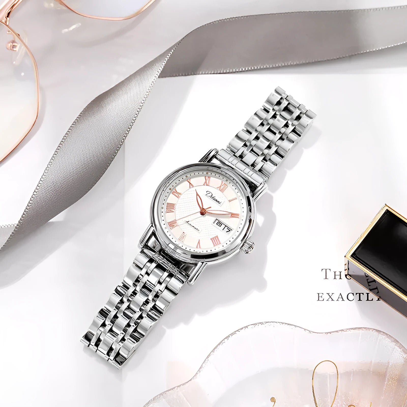 Women's automatic mechanical watch with 12mm thick case on a stainless steel bracelet with a white dial.