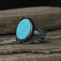 Men's round turquoise alloy ring in antique silver finish on size chart showing UK sizes 6 to 13
