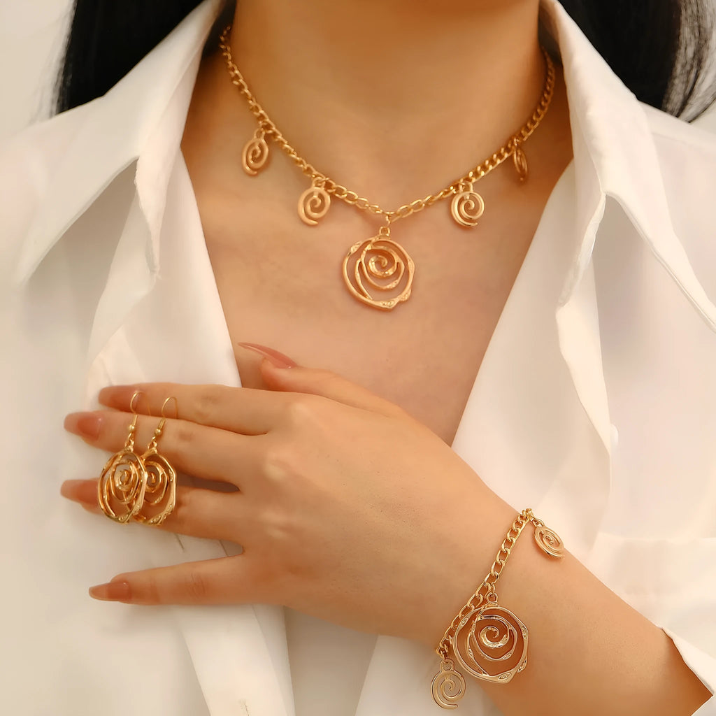 Spiral donut design women's jewellery set showing matching necklace, bracelet, and ear hooks in gold electroplated finish