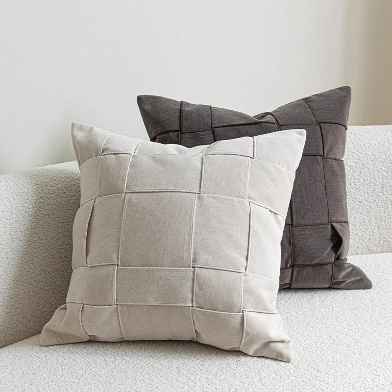 50cm square chenille woven pillow cushion in a choice of seven colours on a sofa.