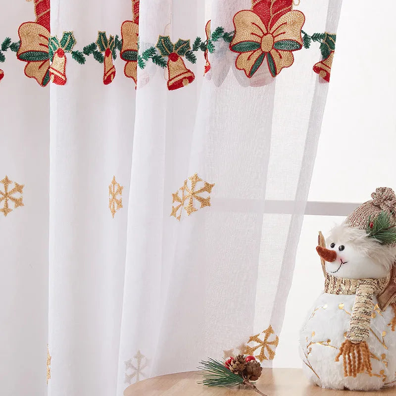 American Christmas curtain with white snowflake embroidery on red fabric, hanging as a pair.