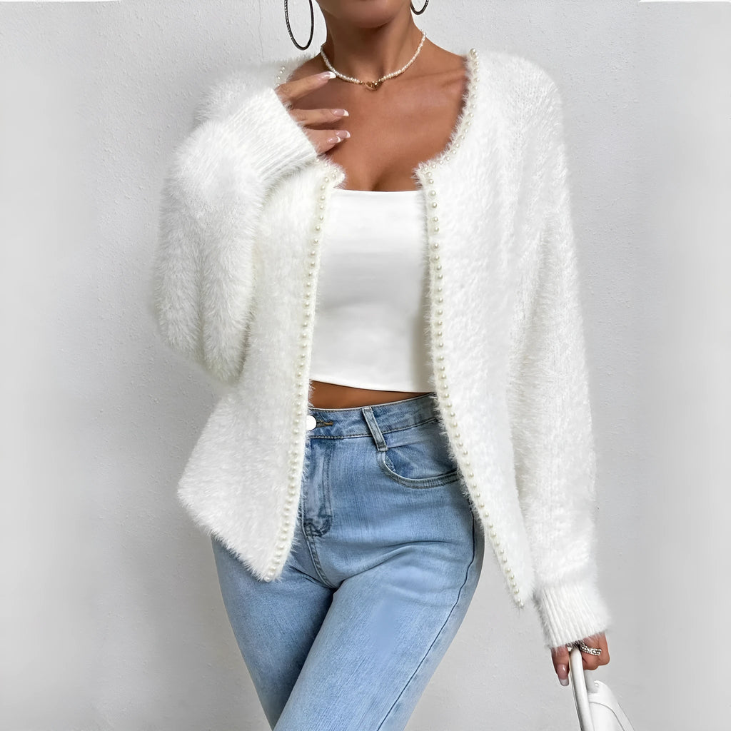 White women's V-neck cardigan with regular length polyester knit construction