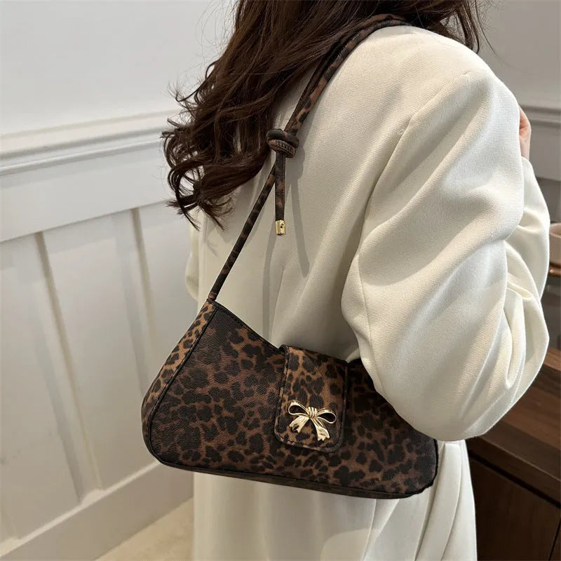 Women's casual PU leather handbag showing sandwich pocket design and available colour options