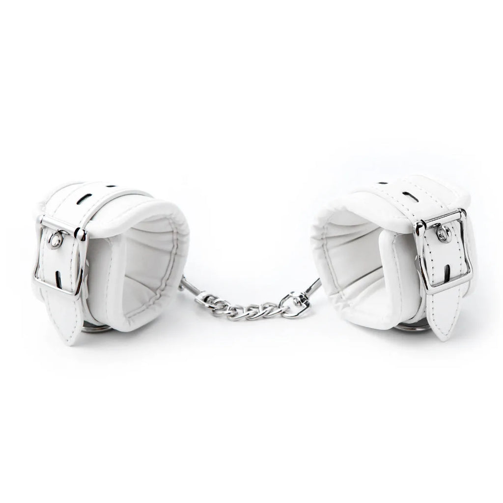 White PU sponge bondage set showing handcuffs, foot cuffs and neck scarf for restraint play