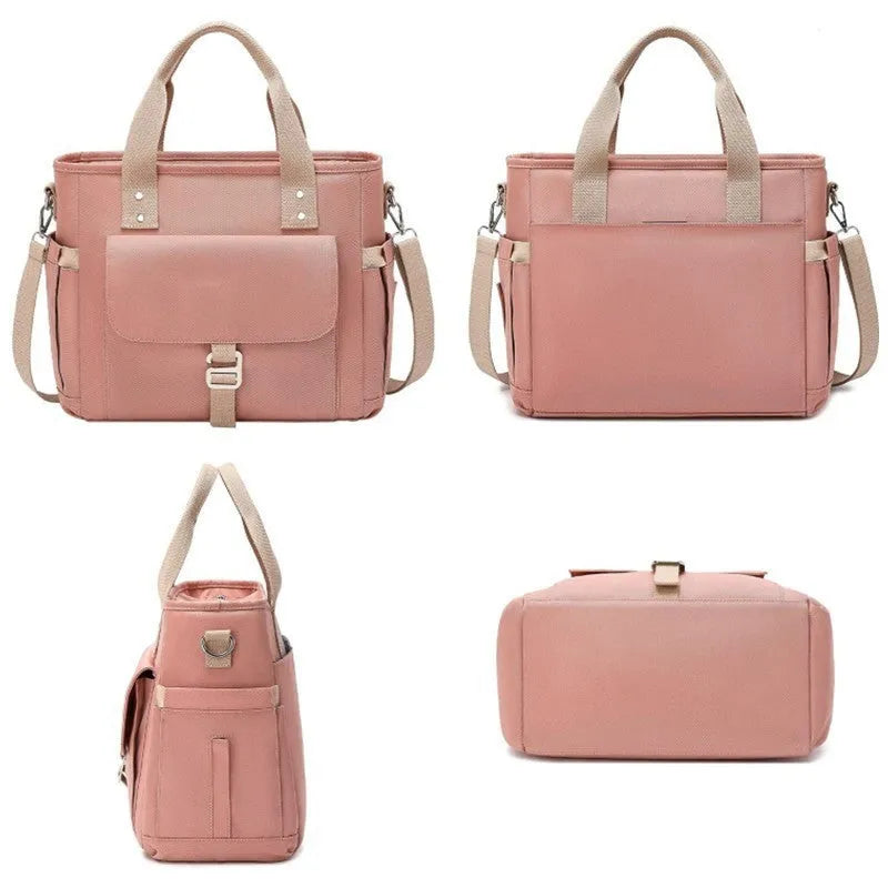 Insulated Oxford cloth picnic bag with removable shoulder strap and side pocket in black, green, or pink.
