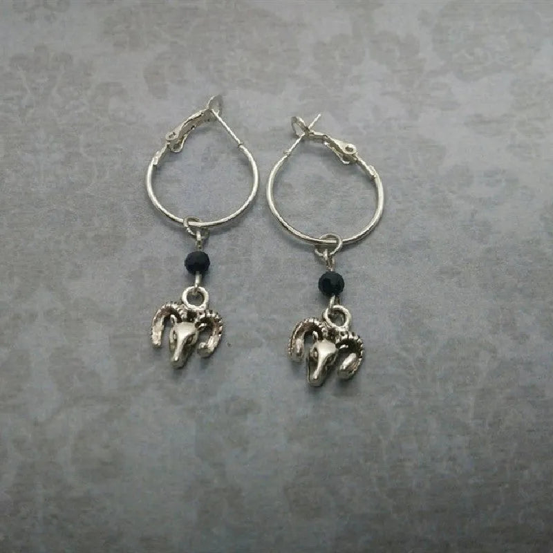 Silver-colour alloy earrings with a round ring Tibetan antelope design for women.
