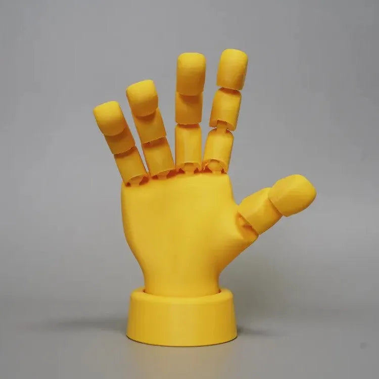 Yellow articulated hand props with movable joints measuring 5x5.38x7.5cm