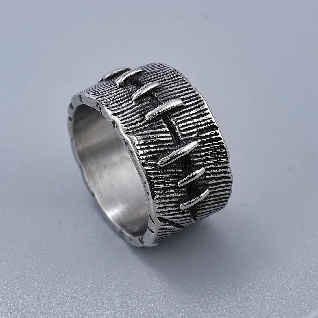 Dark punk-style geometric titanium steel double ring in retro colour on a U-shaped band.