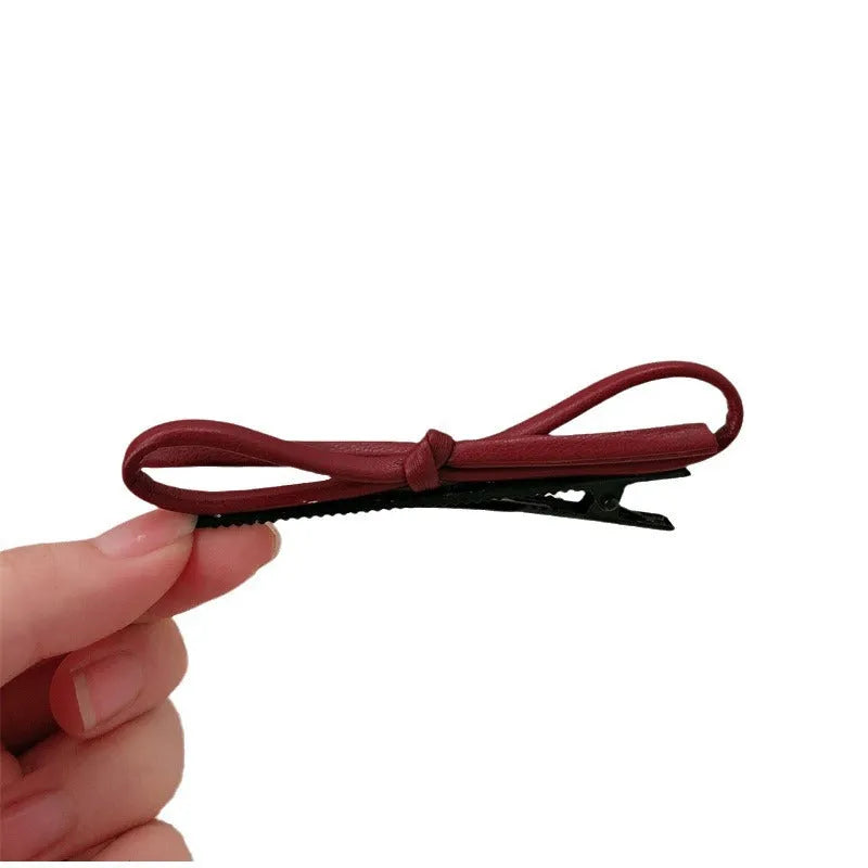 Wine red leather bow barrettes hair clips for women, available singly or in pairs