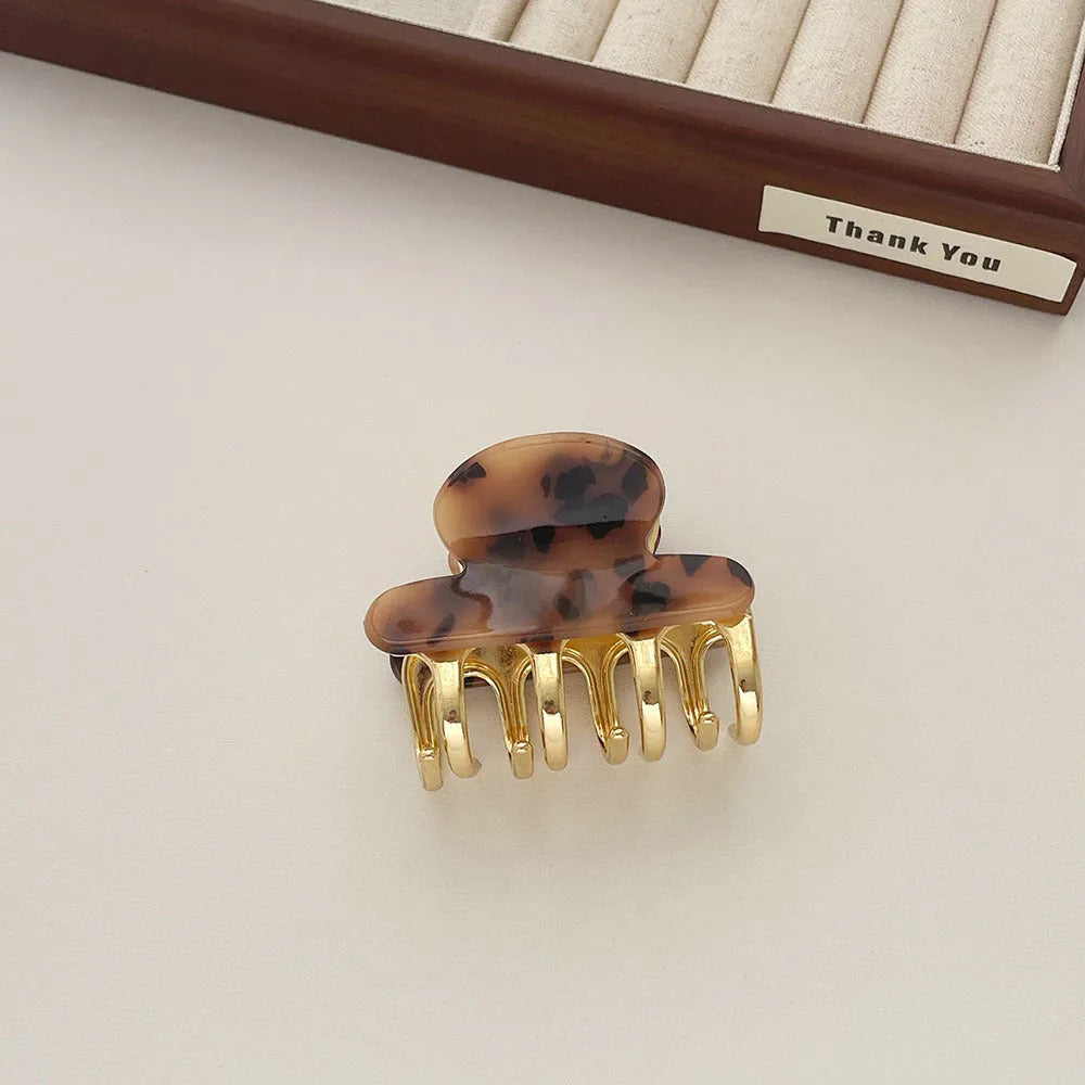 Women's retro acetate hair barrettes with metal grip in medium size showing four R08 colour options